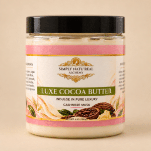 Simply Natu-Real Alchemy Luxe Cocoa Butter in Cashmere Musk on a warm beige background.