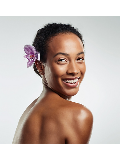 Smiling woman with a flower in her hair